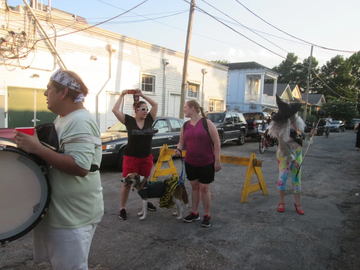 some people are playing drum in the street