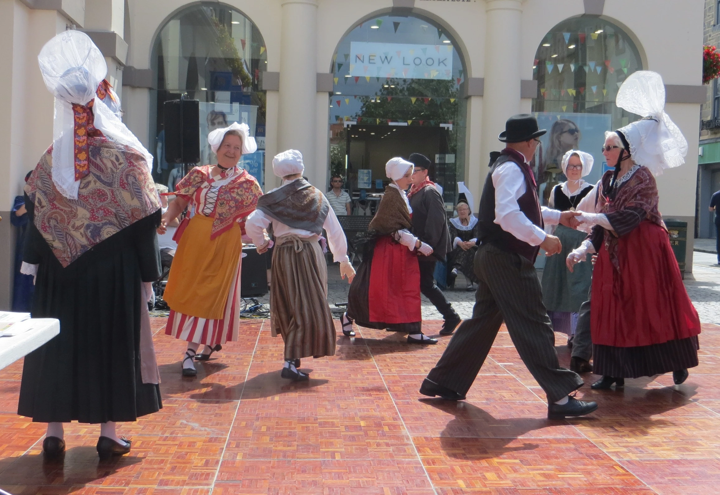 group of people in traditional dress performing a folk dance