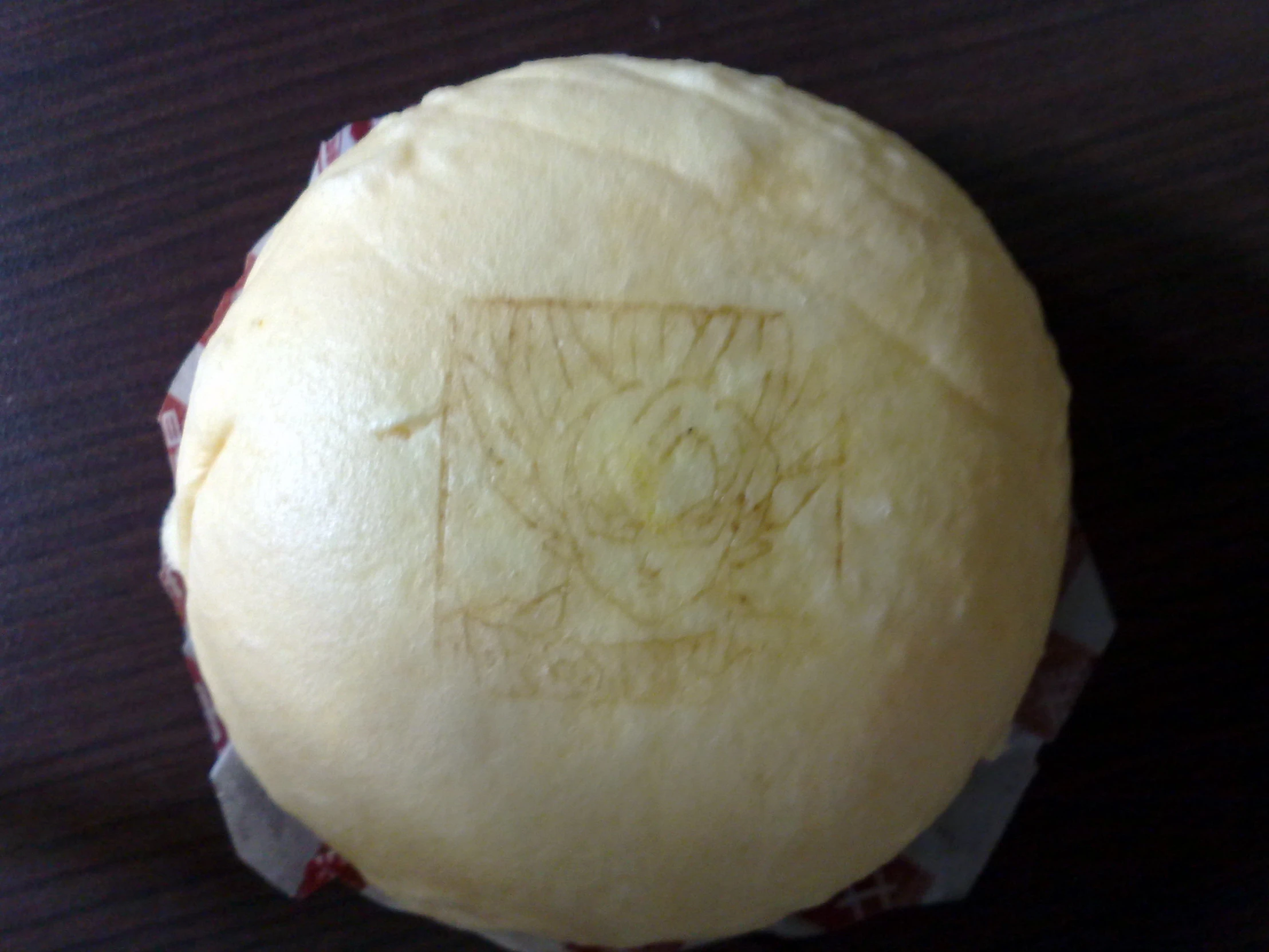 a close up of a piece of food on a wooden table