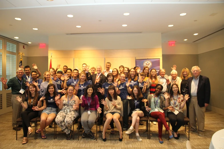 the group poses for a pograph with their award