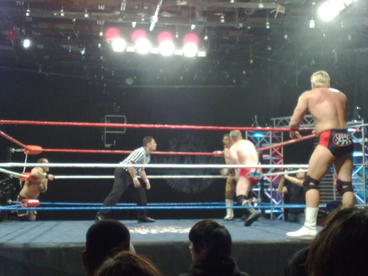 two wrestling wrestlers on the ring after a bout