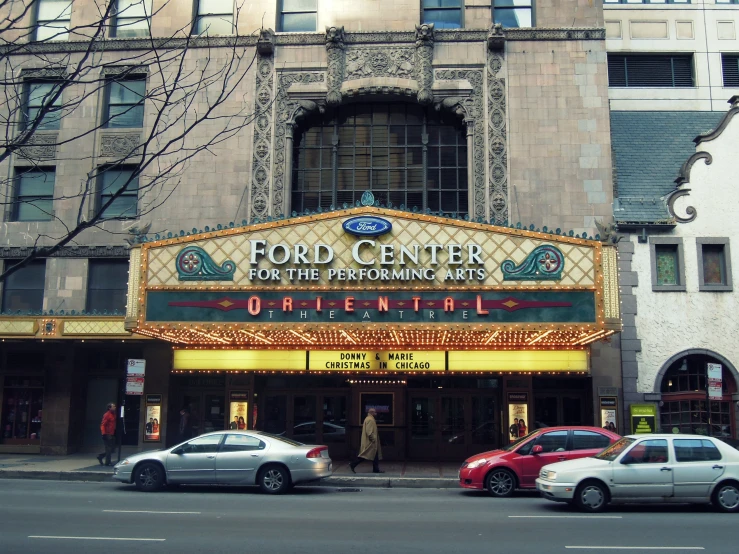 a large building with a theater sign on the side