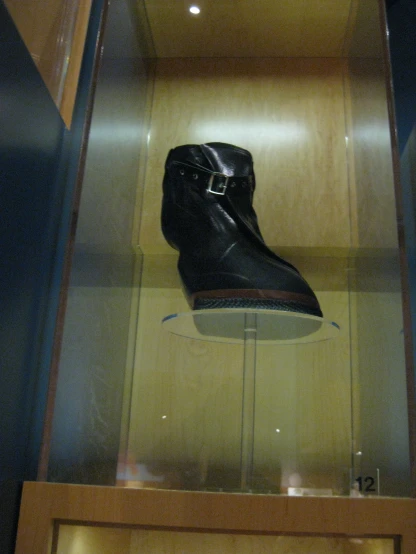an exhibit case containing shoes on display