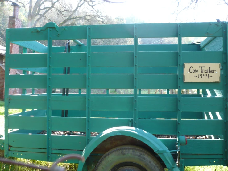 this is an image of the back side of a large green truck