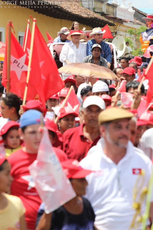 several people with red flags on their backs