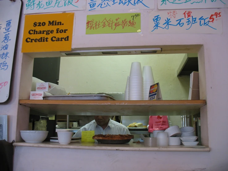 a man standing in a kitchen preparing food