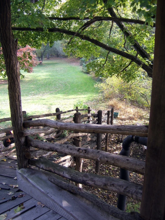 wood and logs fence with pipes running through them