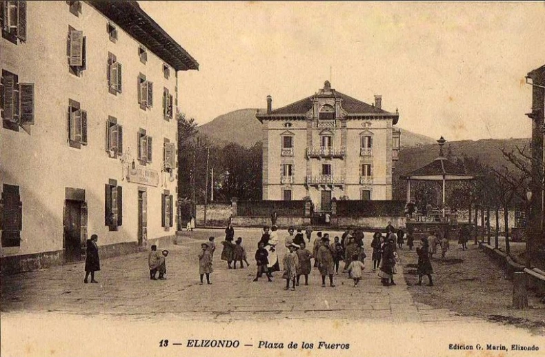 a black and white po of some people and a building