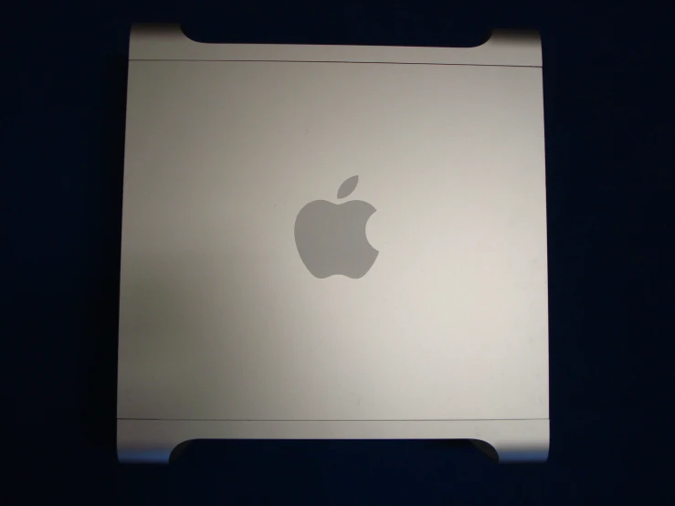 the apple logo on an aluminum case for a laptop