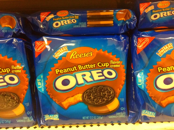 three bagged oreo snacks are stacked on the shelf