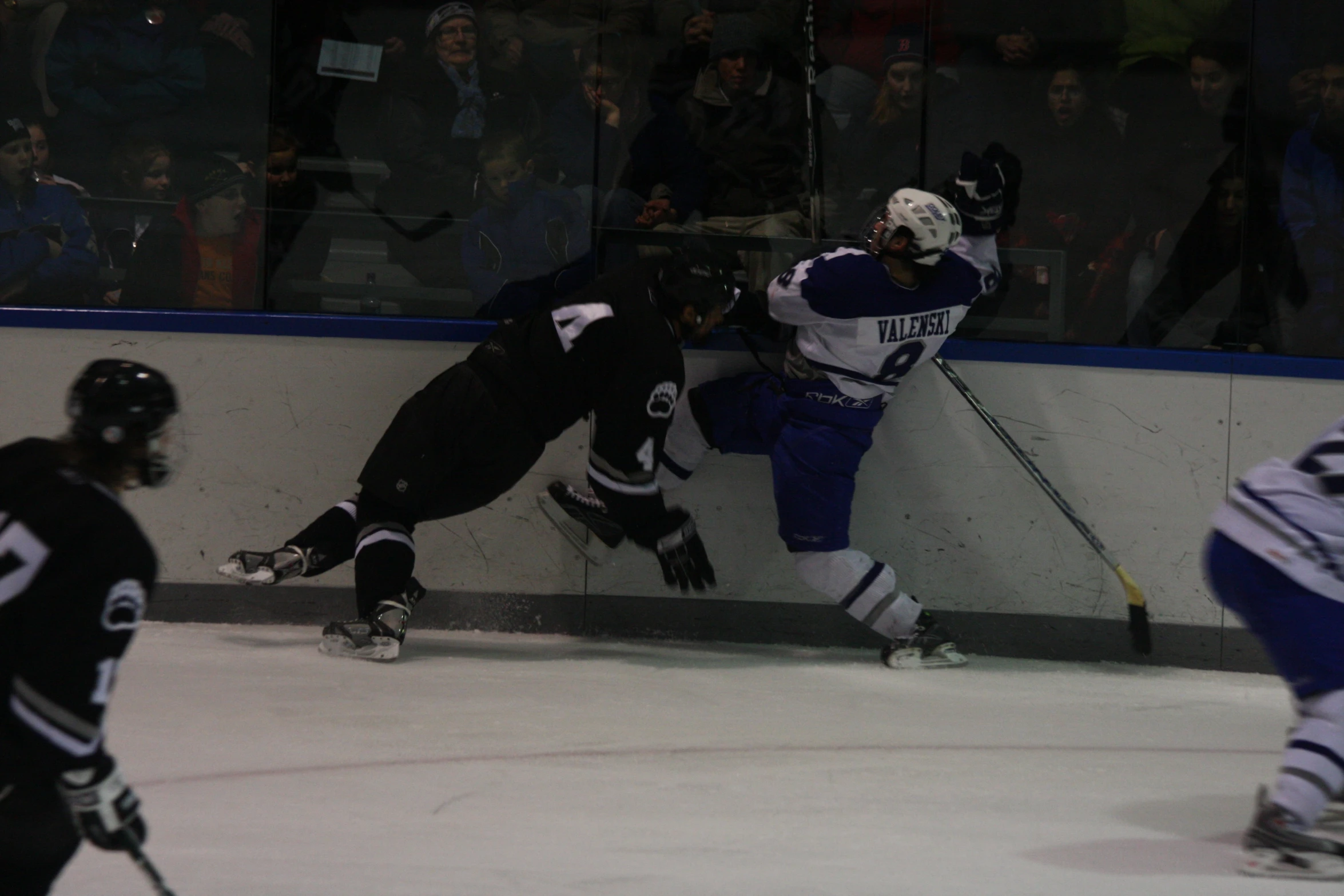 a group of hockey players on the ice during a game