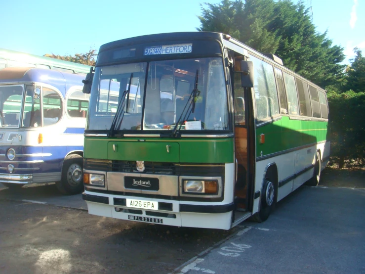 this is a bus parked next to another bus