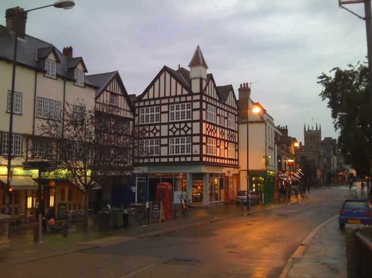 a european city street at night with old buildings