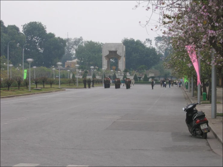 the motor cycle is parked on the street