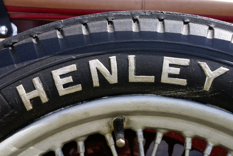 there is a closeup of the word'henley'on a black and white tire