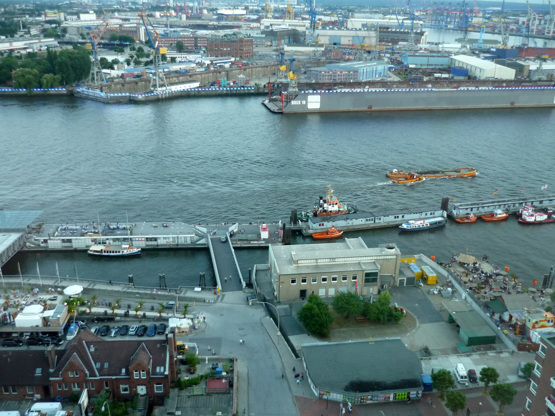 the boat dock is on a large waterway