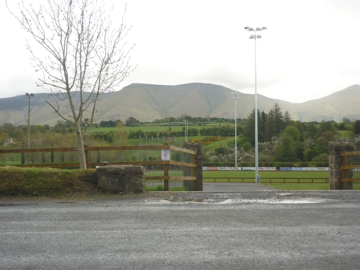 the gate leading to the entrance to the golf course