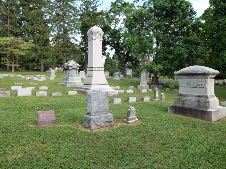 a large cemetery with many headstones in it