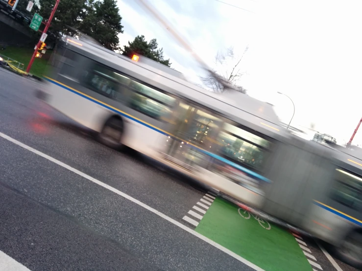 a very blurry po of a train traveling through town