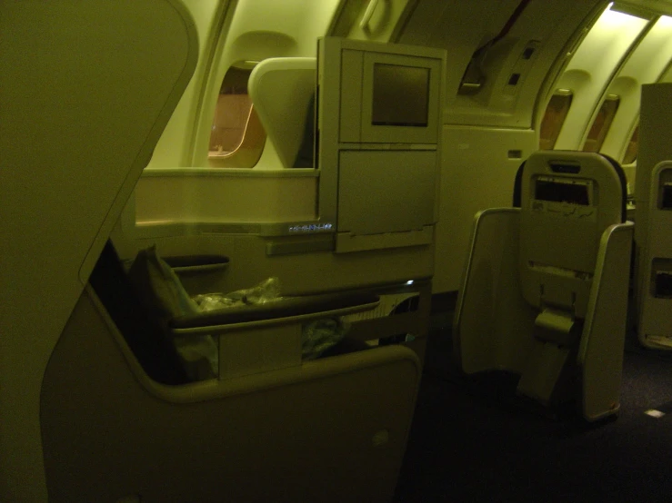 an airplane with the seats empty and lights on