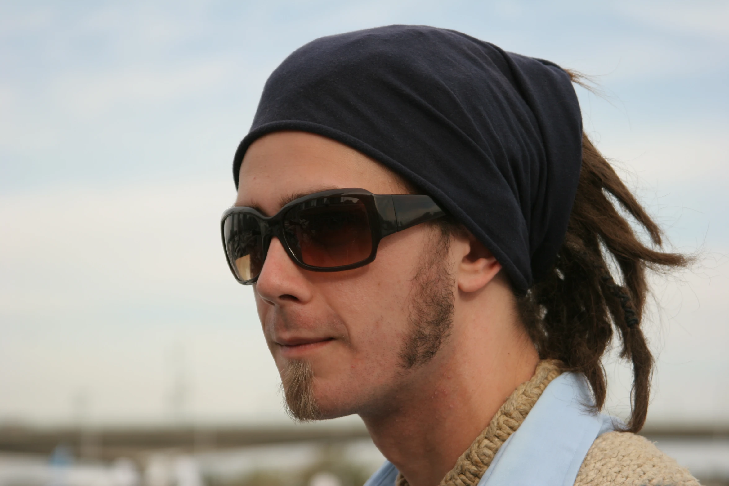 a man wearing sunglasses and a beanie