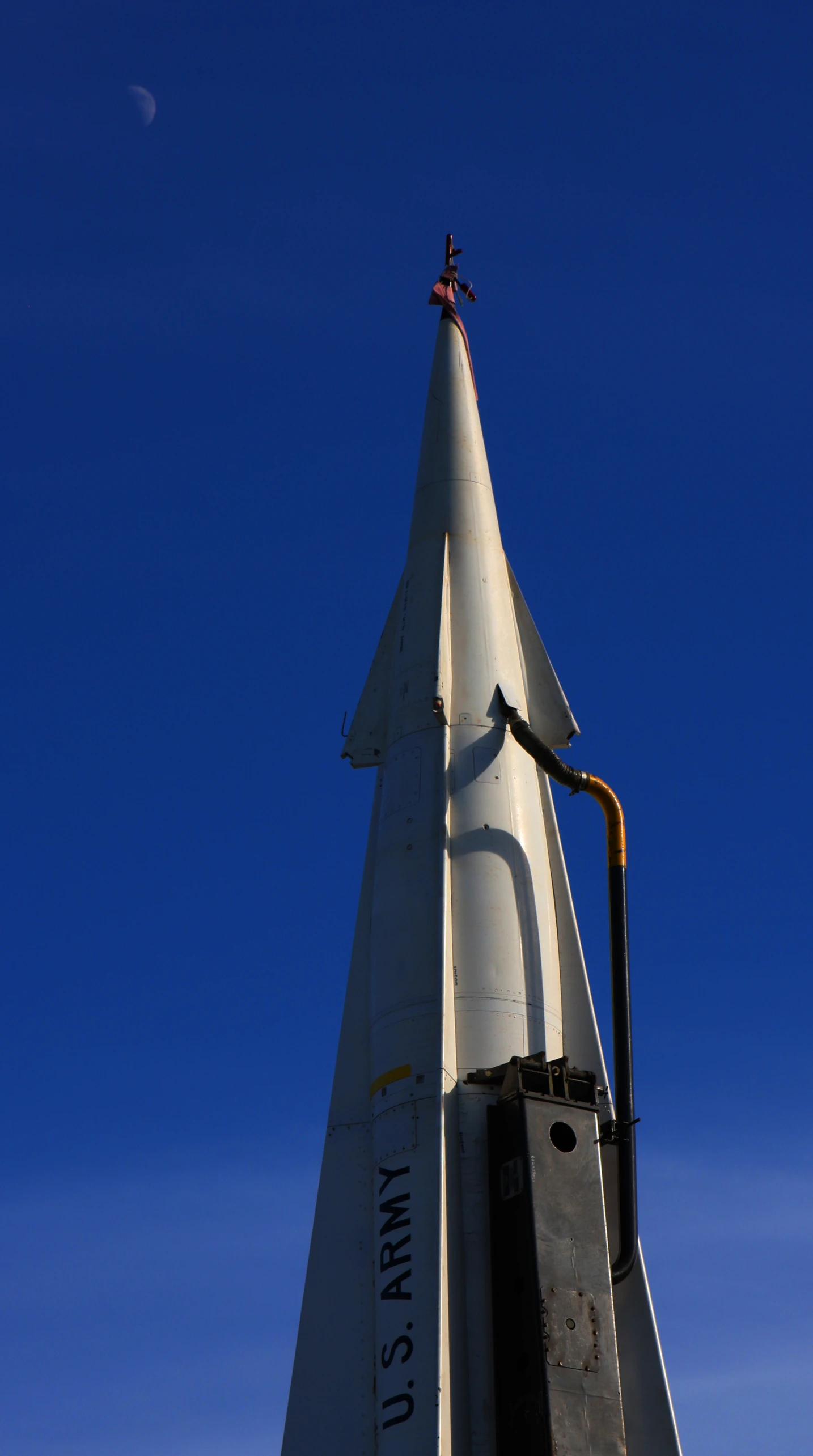 a rocket shaped building that has it's nose up