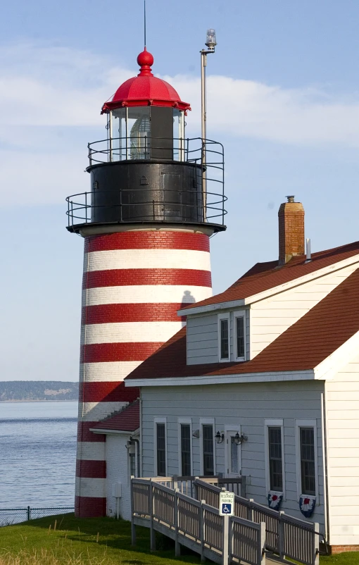 a light house near a big body of water