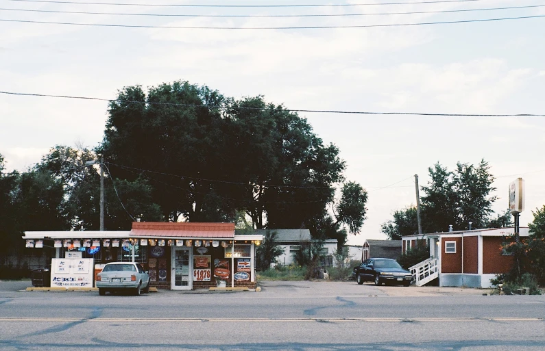 the street side with many vehicles parked and no one is there