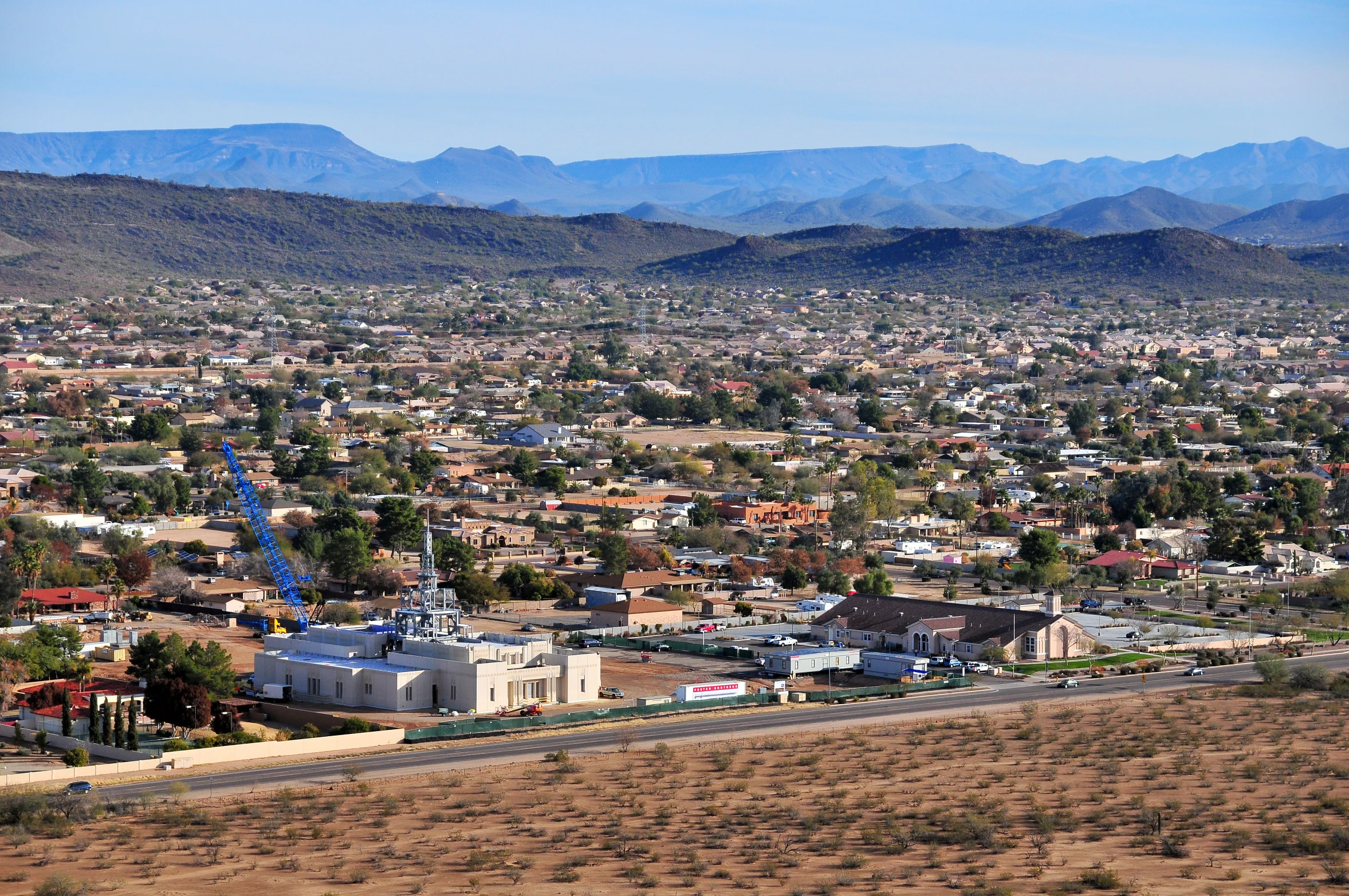 a city with hills in the background is seen from a bird - eye view