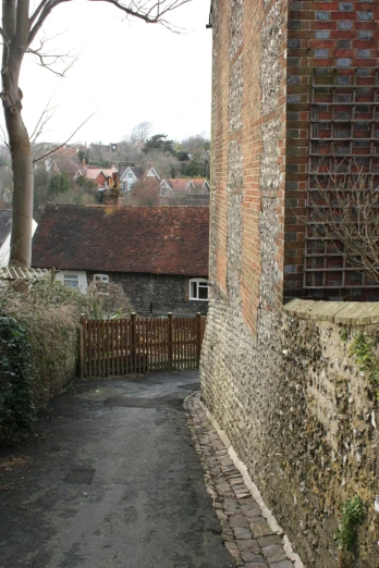 alley way in an old village with houses in the background