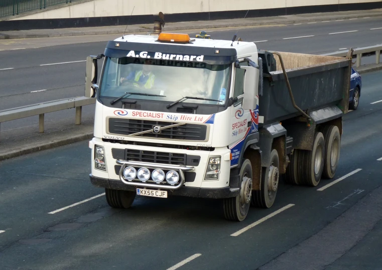 truck with a trailer driving on the highway