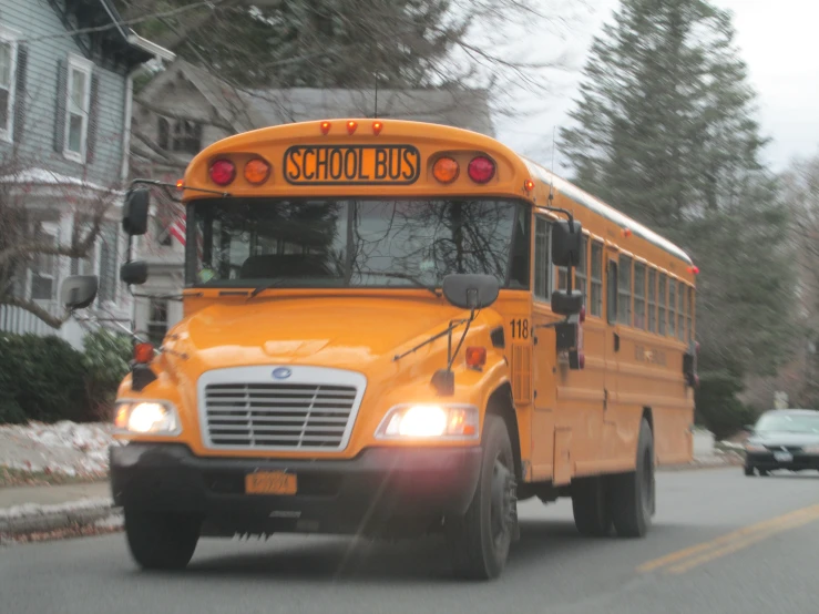 an image of a school bus driving down the road