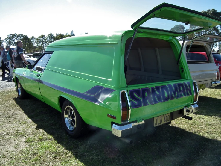 an old pick up truck is parked in the grass