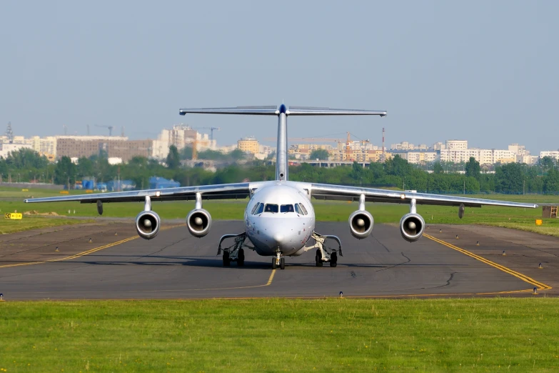 a large plane is parked on a runway