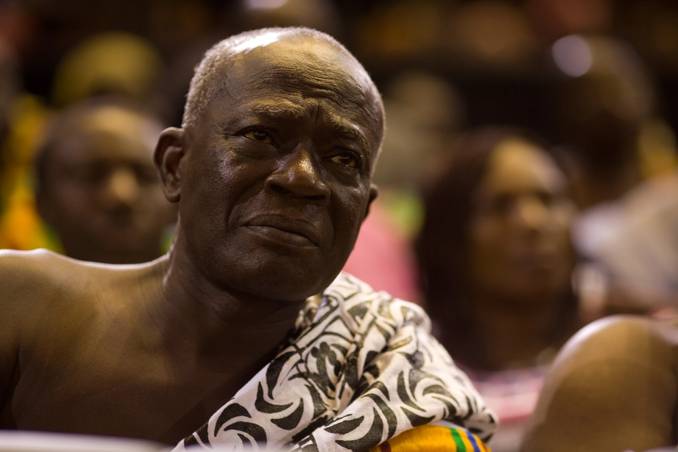 this older man is frowning with a tie around his neck