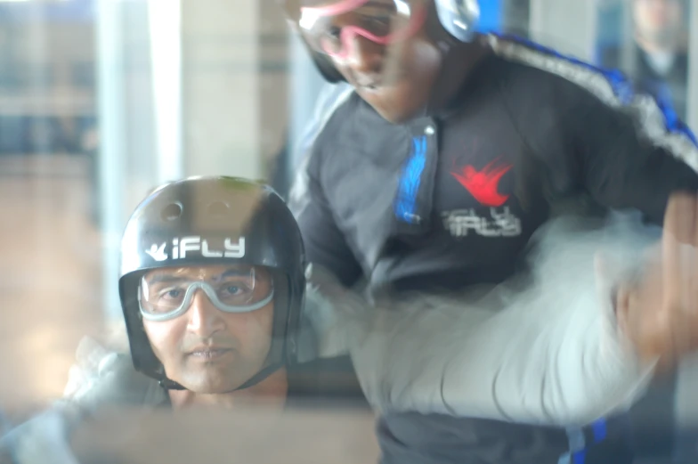two men who are wearing goggles and helmets