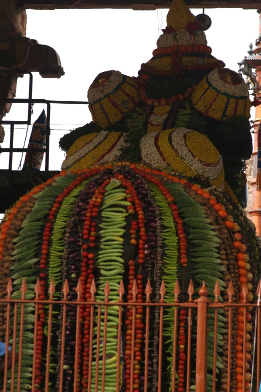 a colorful and intricately designed structure of a plant and fence