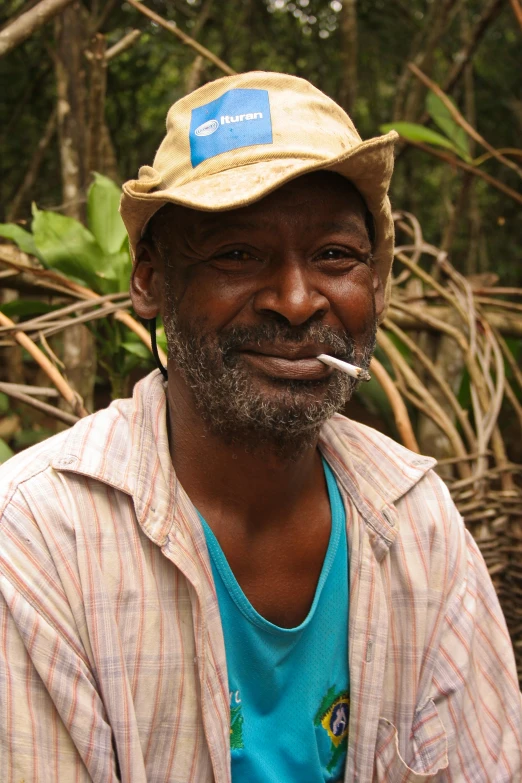 a person sitting next to a pile of trees