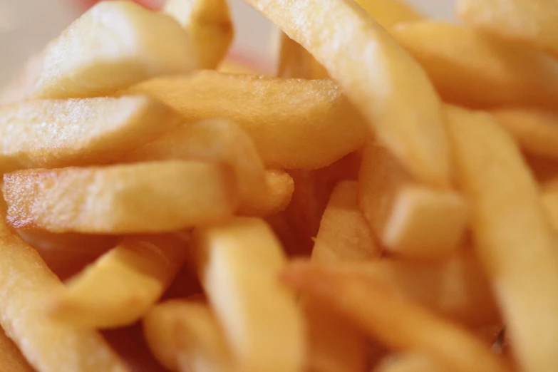 a pile of food containing some cut up french fries