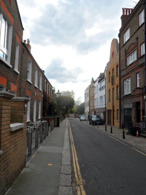 the narrow street leads to several different buildings