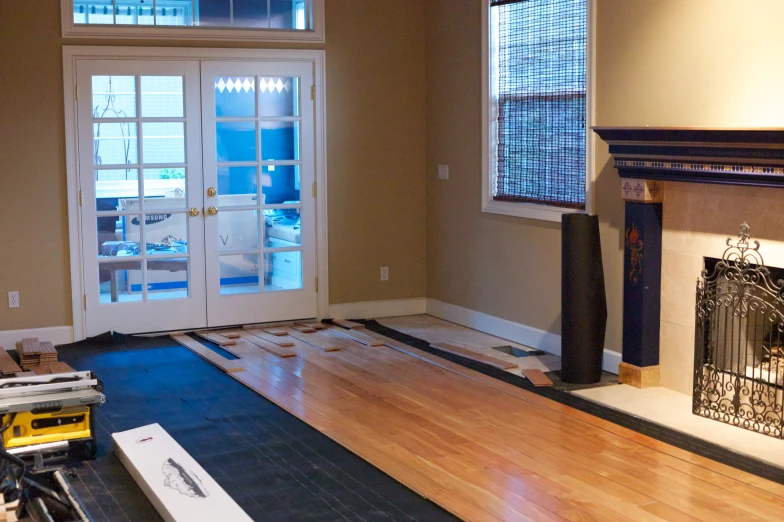 a house is being constructed with hardwood floors and painted trim