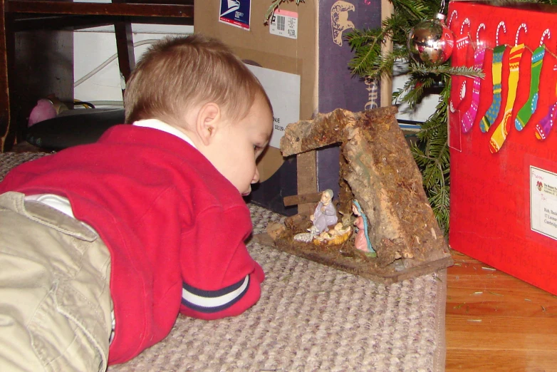 a young child playing with some toys in a room