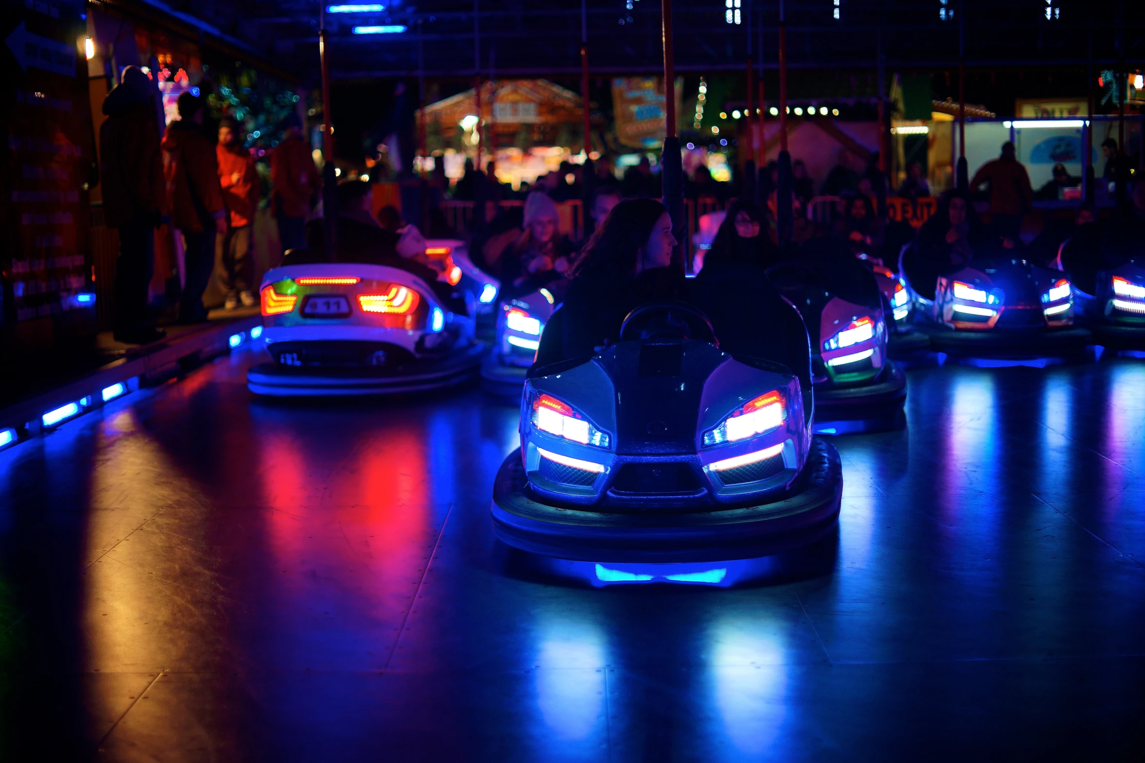 a variety of bumper cars at an amut park