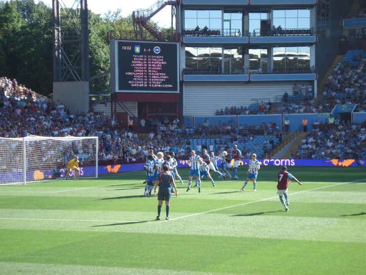 a group of people in front of a crowd watching a game