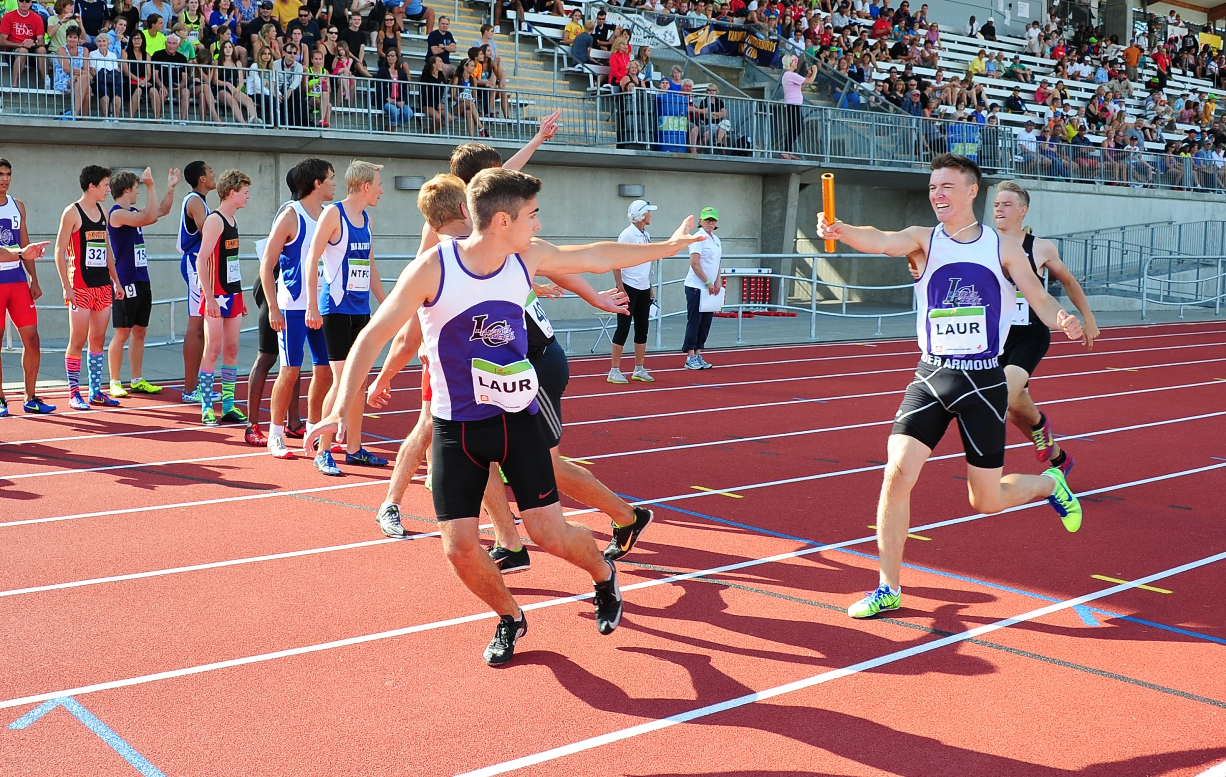 the men are on their teams racing together