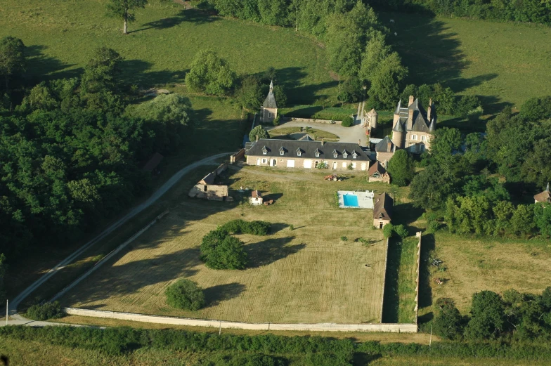 an aerial view of a house in the countryside