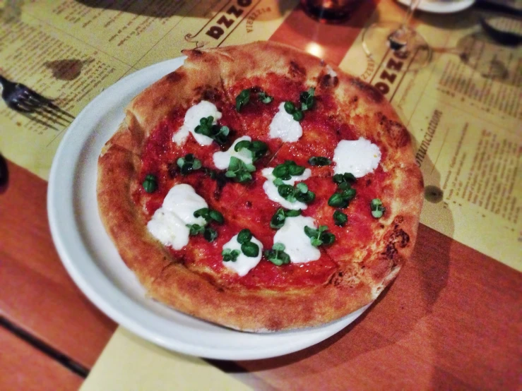 a pizza on a plate on a table