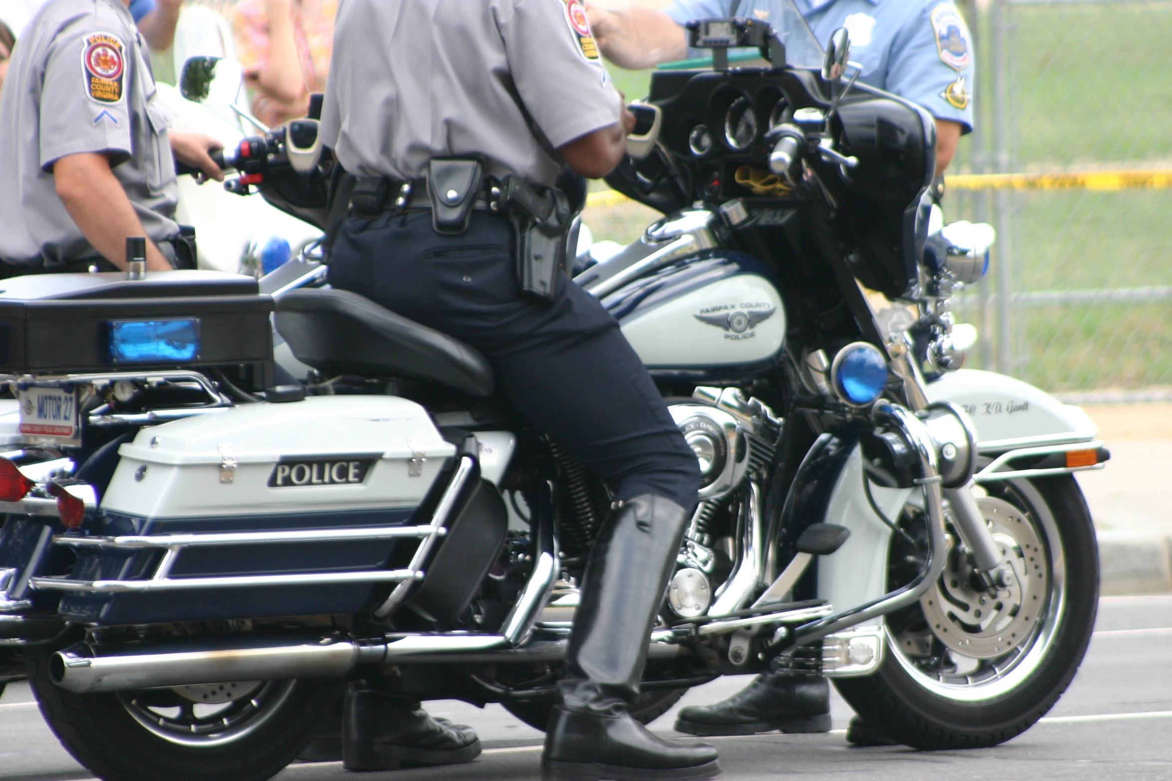 there is a police officer on the back of a motorcycle