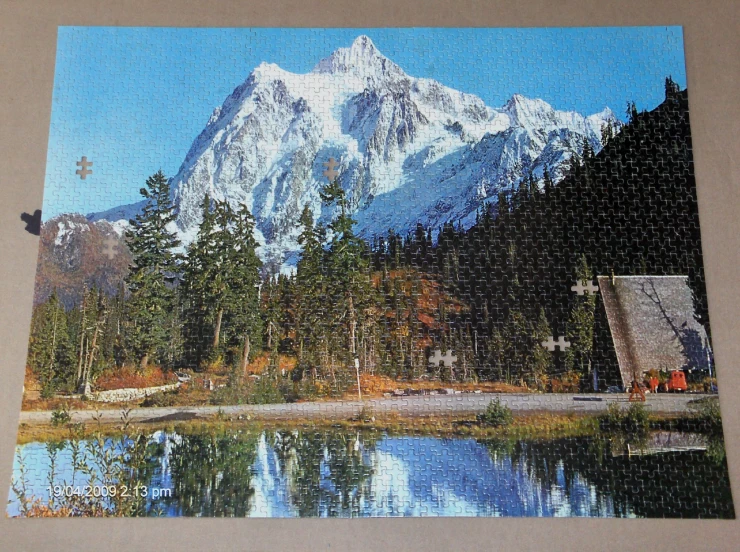 a jigsaw with a mountain view on the side