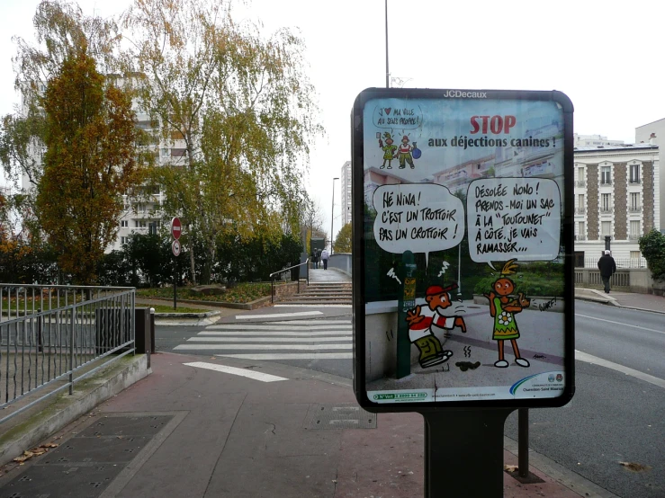 a cartoon sign is shown on the sidewalk